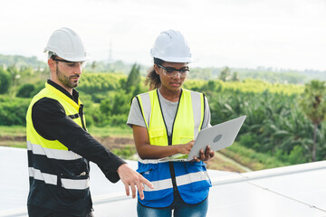 Wall Mural - Engineer technician team using laptop checking and operating system on rooftop of plant farm, Renewable energy source for electricity and power, Solar cell panel maintenance service concept