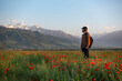 © Chepko Danil - Young man of travelers walking in puppy field in mountain