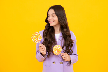 Poster - Teenage girl with lollipop, child eating sugar lollipops, kids sweets candy shop. Excited teenager girl. Happy teenager, positive and smiling emotions of teen girl.