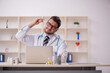 © Elnur - Young male doctor working at the hospital