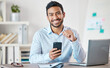 © Jesse B/peopleimages.com - Happy, phone and portrait of business man in a office with startup and technology. Motivation, smile and happiness of businessman with insurance agency work with mobile text and development at job