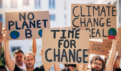 Wall Mural - Group, poster and together in street for planet, climate change and sustainable future in city. People, cardboard sign and activism for change, sustainability or justice for environment in metro road