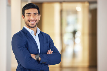 Poster - Confident, portrait and a businessman with arms crossed for corporate company, job and professional career. Happy, suit and a young Asian employee with a smile, pride and happiness at the office