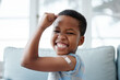 © Siphosethu F/peopleimages.com - African boy kid, vaccine and portrait with smile, medicine and flex muscle for wellness in hospital. Male child, strong and excited with plaster for injection, healthcare and injection to stop virus