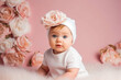 © VisualProduction - Adorable baby white outfit in nursery. Pastel pink background baby portrait. Generative AI