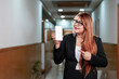 © Niks Ads - Young indian businesswoman showing smartphone screen at office