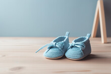 Knitted Blue Footwear On The Wooden Floor In Light Interior. Concept Of The Birth Of A Child, Having A Baby. Generative AI
