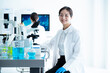 Portrait of Scientist sitting on her desk in the Laboratory
