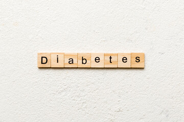 Wall Mural - diabetes word written on wood block. diabetes text on table, concept