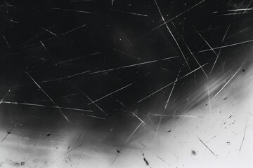 A black background with white lines and a dark tone, creating an abstract pattern.