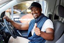 Delivery Guy, Transport Or Man Driving With Thumbs Up, Shipping Or Courier Service. Happy Black Person, Portrait Or Driver For Like, Support Emoji Or Hand Sign In Van, Cargo Vehicle Or Transportation