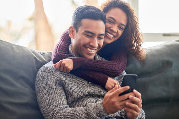 Poster - Happy couple, phone and sofa laughing for social media, internet meme or online streaming service at home. Young interracial woman and man or partner on website, connection and hug or love on couch