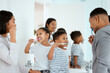 © K.A./peopleimages.com - Dental, family brush their teeth and in bathroom of their home together in the morning. Care or love with hygiene, wellness and black people cleaning for healthcare with toothbrush at their house