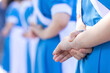 © nut_foto - Young Thai female nursing students cross their arms behind their backs and stand in a line to celebrate senior nurses' graduation.