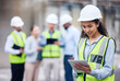 © Michael Cunningham/peopleimages.com - Business woman, architect and tablet in leadership, project management or inspection for construction on site. Female person, engineer or manager with technology and team for industrial architecture