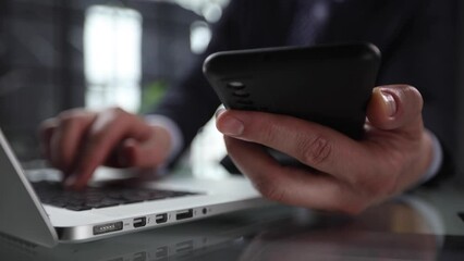 business man hands busy using cell phone at office desk