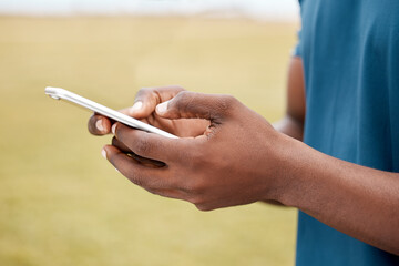 Aufkleber - Man, hands and phone for social media, communication or networking in sports on grass field outdoors. Hand of male person or athlete chatting, typing or texting on mobile smartphone app in nature