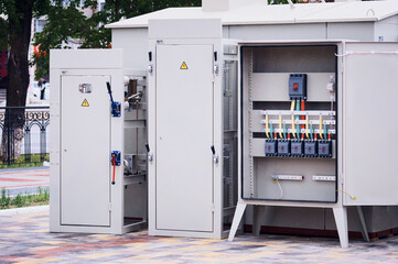 Panels of electrical switches in the open air for inspection at the exhibition. Open cabinet with access to circuit breakers. Power installations of the distribution network of power supply.