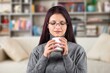 © BillionPhotos.com - Happy young woman drink tea or coffee at home