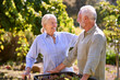 © Monkey Business - Retired Senior Couple Working In Vegetable Garden Or Allotment Carrying Tray Of Beets
