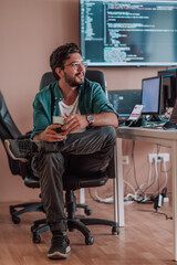 A programmer diligently testing smartphone applications while sitting in their office.