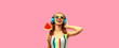 Summer colorful portrait of cheerful happy laughing young woman in headphones listening to music with juicy lollipop or ice cream shaped slice of watermelon on pink background