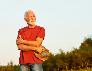 Wall Mural - portrait senior man elderly old retirement mature gray hair farm farmer outdoor healthy active retir