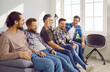 © Studio Romantic - Group of close friends sitting on sofa at home. Happy hipster guys relaxing on couch in apartment talking to each other, enjoying leisure time. Meeting of best friends, friendship concept