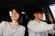 © velimir - positive couple in love ride in a car on a trip to a date on a sunny day