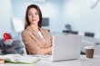 © BillionPhotos.com - Cheerful businesswoman at desk in office with computer