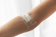 © EleniaPhoto - The site of the blood test from a vein on the arm is sealed with a plaster. Photo