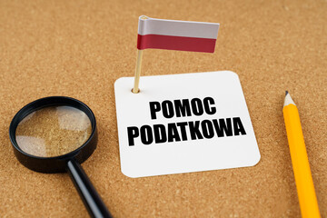 Wall Mural - On the table is the flag of Poland, a pencil and a sheet of paper with the inscription - TAX Help