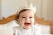 Cute Sweet Adorable Baby wearing bride dress and diadem Sitting on white bed smiling and playing with happiness emotional in cozy bedroom, Healthy happy Baby Concept. Generative AI