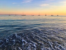 Sailing Boats Anchored In Pacific Ocean At Sunset, Capitola Beach, Santa Cruz County, California, USA