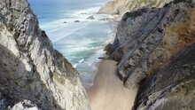 Aerial View Of Praia Da Adraga Beach And Rock Cliffs On West Coast Of Portugal