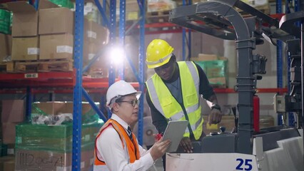 Wall Mural - Diverse industrial worker team working in manufacturing plant together.