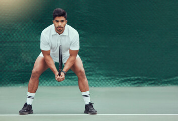 Canvas Print - Sports, space and man at court for tennis, training and mockup, mindset and focus on green background. Fitness, workout and Indian male player with racket for match, competition and body exercise