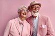 Photo of stylish happy smiling pensioners retired on pink color background. Happy smiling couple of pensioners in matching outfit of pastel colors. Romantic love. Generative AI.