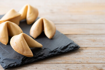 Traditional fortune cookies on wooden table. Copy space