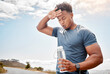 Fitness, outdoor and black man drinking water, tired and exercise with wellness, health and cardio training. Male person, guy or athlete outside, resting and liquid with practice, sweating and sports