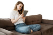 © muse studio - A woman uses a tablet at home on the sofa online shopping on the Internet. Transparent background, isolated.