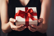© julijadmi - Woman hands holding a gift box for special event. Valentines day, Christmas, Birthday concept. Generative AI.