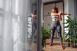 © Impact Photography - Woman stretching arms after workout