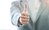 Fototapeta  - Businessman, hand and thumbs up for approval, success or corporate winning at the office. Hands of man with thumb emoji, yes sign or like for achievement, agreement or thank you at the workplace