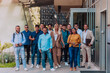 © .shock - A diverse group of businessmen and colleagues walking together by their workplace, showcasing collaboration and teamwork in the company.