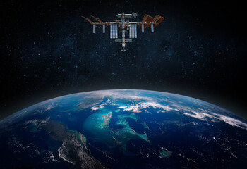 Wall Mural - the international space station orbiting planet earth. elements of this image furnished by nasa. sci