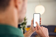 © Westend61 - Man touching blank smartphone display