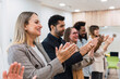 © Westend61 - Happy business people clapping hands after a presentation in office