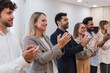 © Westend61 - Happy business people clapping hands after a presentation in office