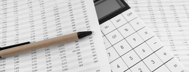 Poster - Calculator with pen on financial statement.